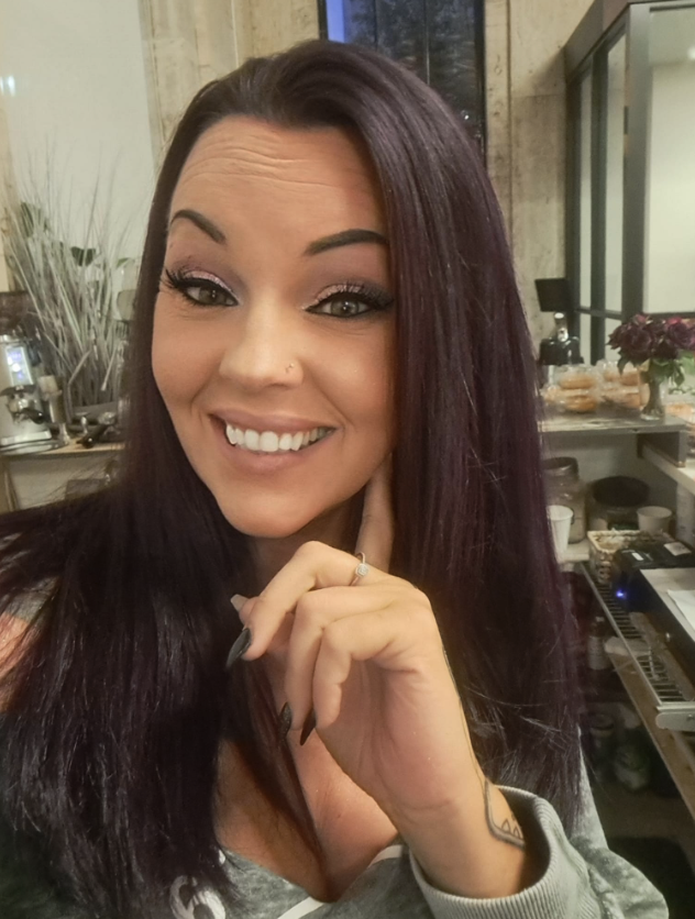 Portrait of Tiffany, founder of Sweet Cheekz Cafe N’ Bistro, smiling inside the café in Sandusky, Ohio